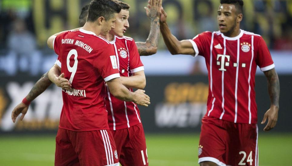 Robert Lewandowski mit Sebastian Rudy und Corentin Tolisso (v. l.) Bild: Key