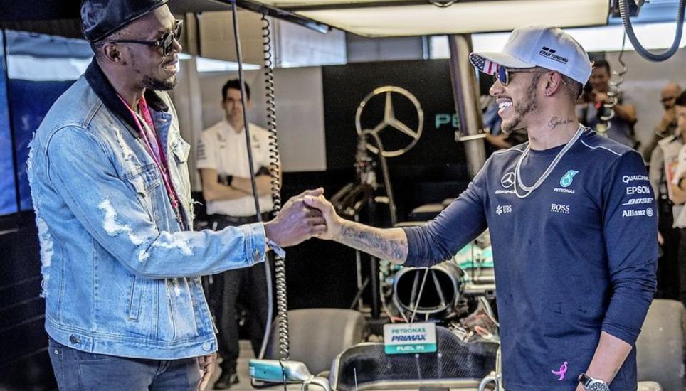 Riesenshow schon vor dem Start zum Rennen in Austin: Der achtfache Olympiasieger Usain Bolt (l.) begrüsst den WM-Führenden Lewis Hamilton. Bild: Key