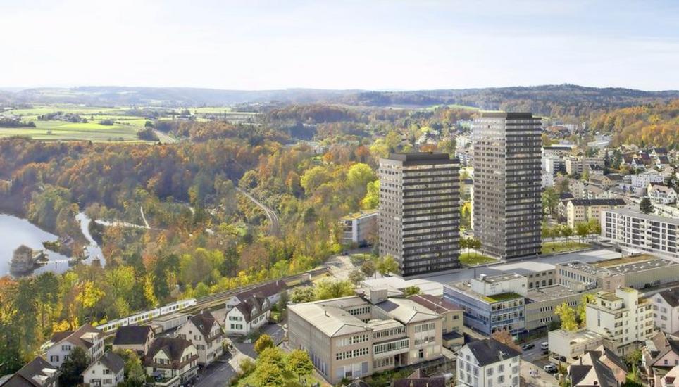 Zwei Hochhäuser von 56 und 75 Metern Höhe sowie ein Winkelbau (zu sehen ganz rechts) sind bei der Überbauung RhyTech-Quartier vorgesehen. Visualisierung: zvg