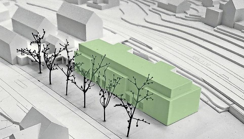 Die geplante Überbauung «Im Dorf West», hier im Modell grün markiert, ersetzt die Langwieser «Waro-Hallen». Bild: zVg/lawisa AG