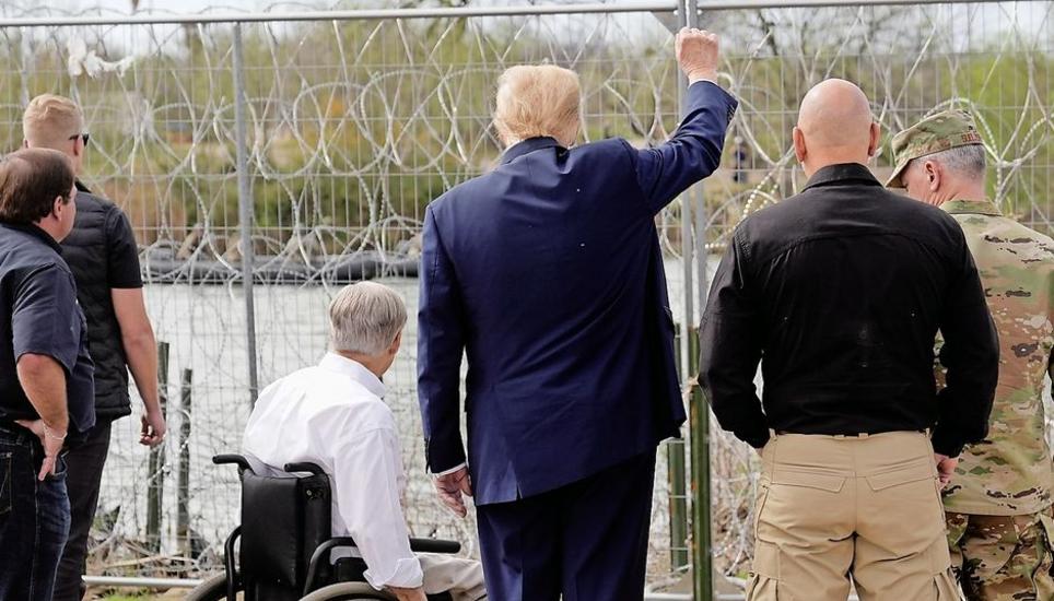 Republican presidential candidate former President Donald Trump gestures to people across the Rio Grande in Mexico at Shelby Park during a visit to the U.S.-Mexico border, Thursday, Feb. 29, 2024, in Eagle Pass, Texas. (AP Photo/Eric Gay)