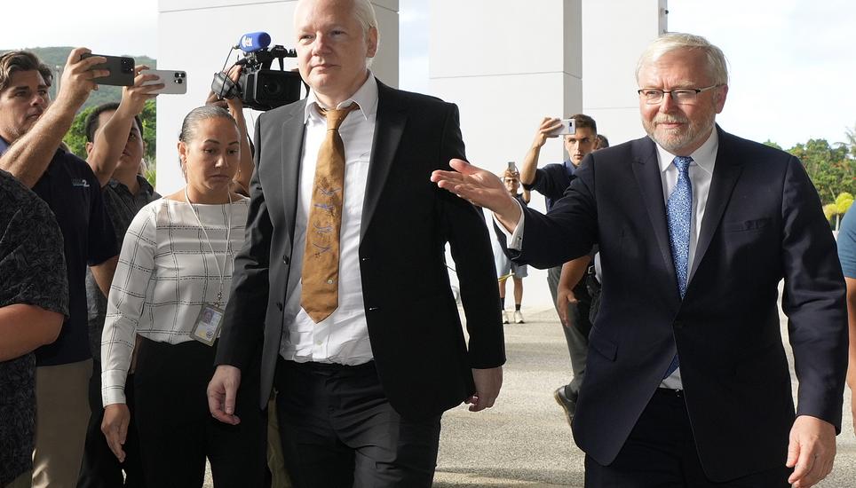 WikiLeaks founder Julian Assange, center, arrives at the United States courthouse where he is expected enter a plea deal in Saipan, Mariana Islands, Wednesday, June 26, 2024. (AP Photo/Eugene Hoshiko)