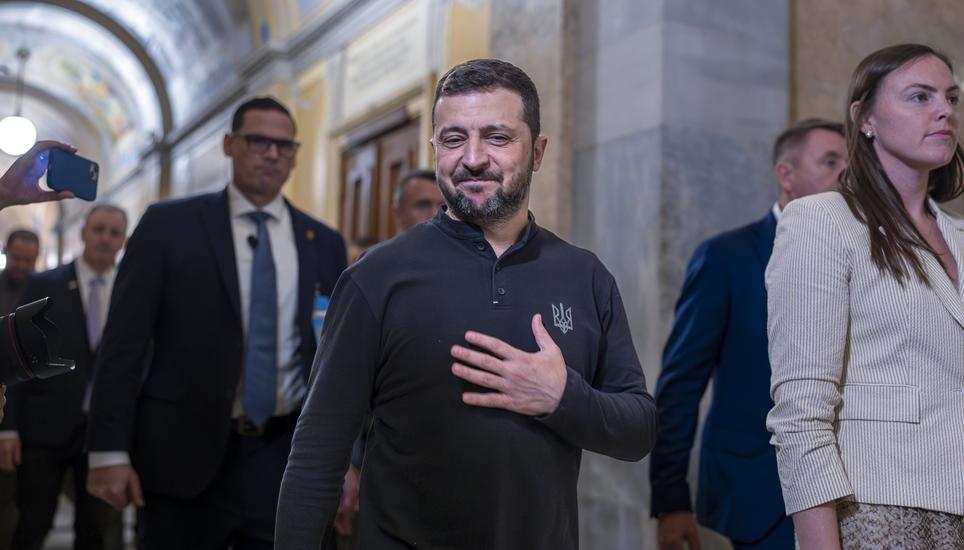 Ukrainian President Volodymyr Zelenskyy, center, gestures with his hand over his heart after a closed meeting with lawmakers in the House of Representatives about the war effort against Russia, at the Capitol in Washington, Thursday, Sept. 26, 2024. (AP P