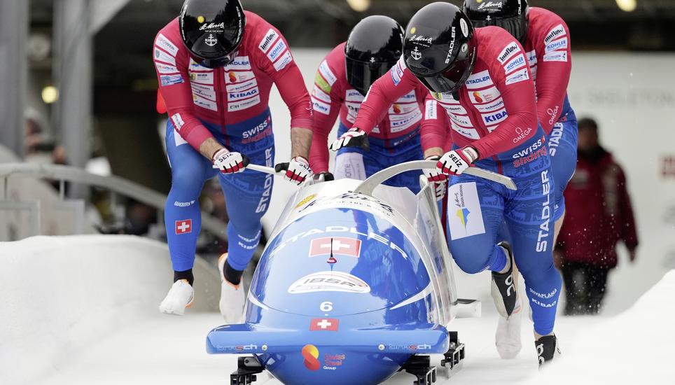 Cedric Follador, Nicola Mariani, Omar Voegele and Dominik Schlaepfer, of Switzerland, compete in the 4-man bobsleigh race at the Bobsleigh World Cup in Innsbruck, Austria, Sunday, Nov. 30, 2025. (AP Photo/Matthias Schrader)