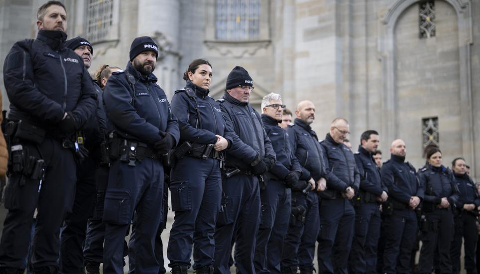 Police gather for a commemorative ceremony and the national day of mourning following the deadly fire at the "Le Constellation" bar in Crans-Montana, on the Klosterplatz in front of the abbey of St. Gallen, in St. Gallen, Switzerland, Friday, January 9, 2