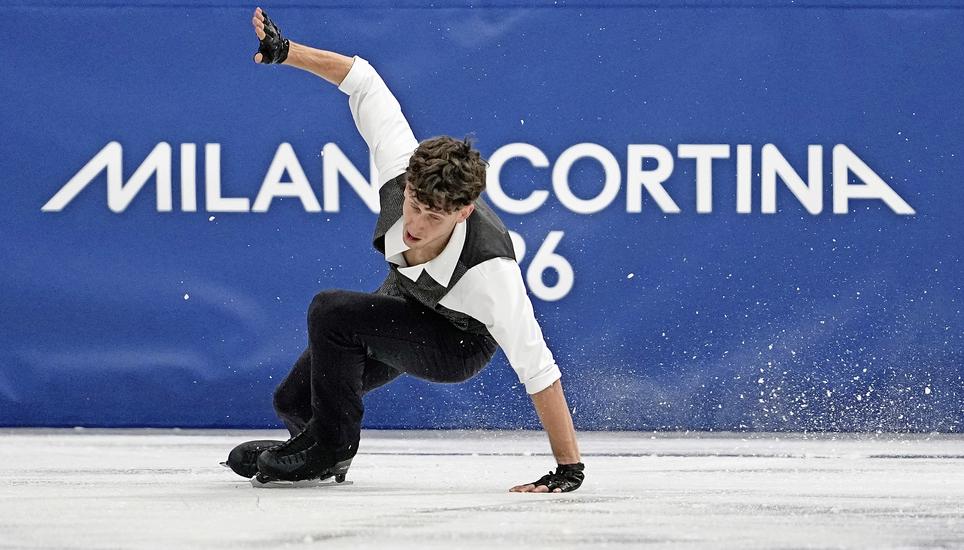 Lukas Britschgi of Switzerland falls during the men's figure skating short program at the 2026 Winter Olympics, in Milan, Italy, Tuesday, Feb. 10, 2026. (AP Photo/Ashley Landis)