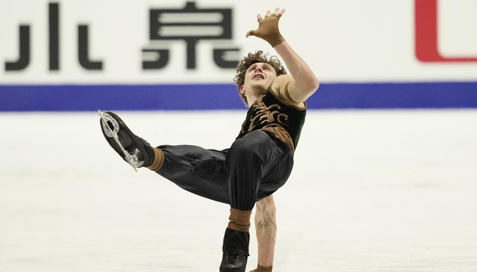 Lukas Britschgi, of Switzerland, performs during the men' free skating program in the ISU Grand Prix of Figure Skating - NHK Trophy in Kadoma, east of Osaka, western Japan, Saturday, Nov. 8, 2025. (AP Photo/Hiro Komae)