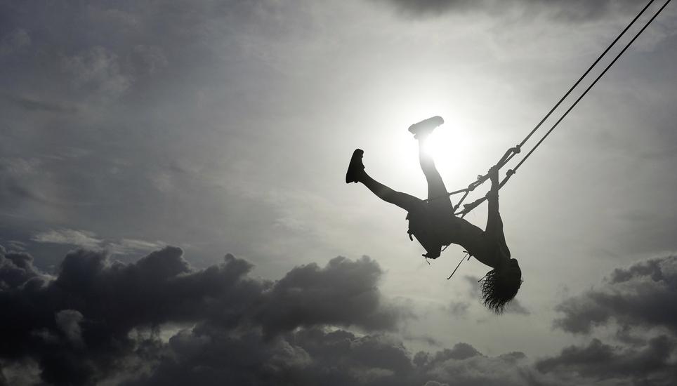 A woman swings on a swing at Venao Beach in Pedasi, Panama, July 13, 2024. (AP Photo/Matias Delacroix)