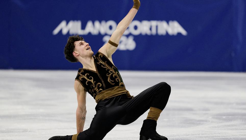 Lukas Britschgi of Switzerland competes during the men's free skate program in figure skating at the 2026 Winter Olympics, in Milan, Italy, Friday, Feb. 13, 2026. (AP Photo/Ashley Landis)