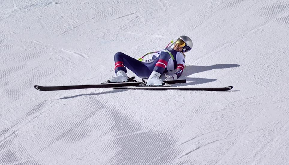 In this image taken from video provided by Olympic Broadcasting Services, OBS, United States' Lindsey Vonn lays on the course after crashing during an alpine ski women's downhill race, at the 2026 Winter Olympics, in Cortina d'Ampezzo, Italy, Sunday, Feb.