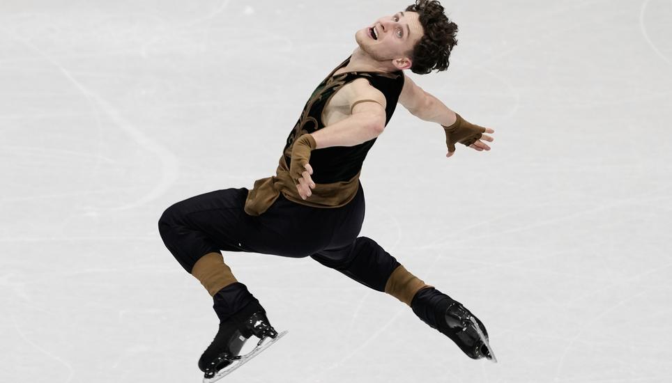 Lukas Britschgi of Switzerland competes during the men's free skate program in figure skating at the 2026 Winter Olympics, in Milan, Italy, Friday, Feb. 13, 2026. (AP Photo/Francisco Seco)