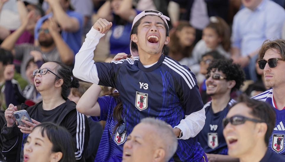 Japan fans celebrate their team's goal against Netherlands as they watch a public viewing of the World Cup soccer tournament between Japan and Netherlands in San Francisco, Sunday June 14, 2026. (AP Photo/Eugene Hoshiko)