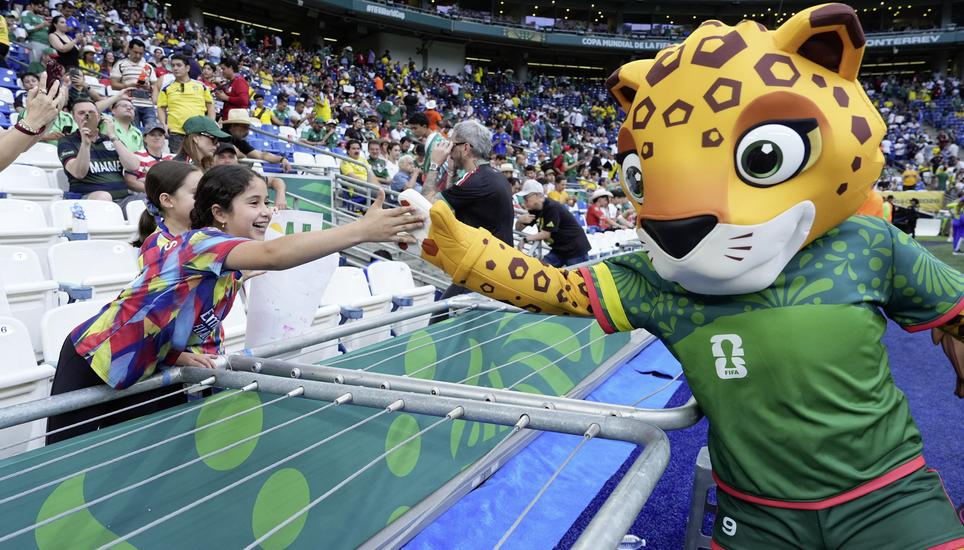 One of the World Cup 2026 mascot Zayu greets with soccer fans ahead of the World Cup Group F soccer match between Sweden and Tunisia in Guadalupe, near Monterrey, Mexico, Sunday, June 14, 2026. (AP Photo/Moises Castillo)