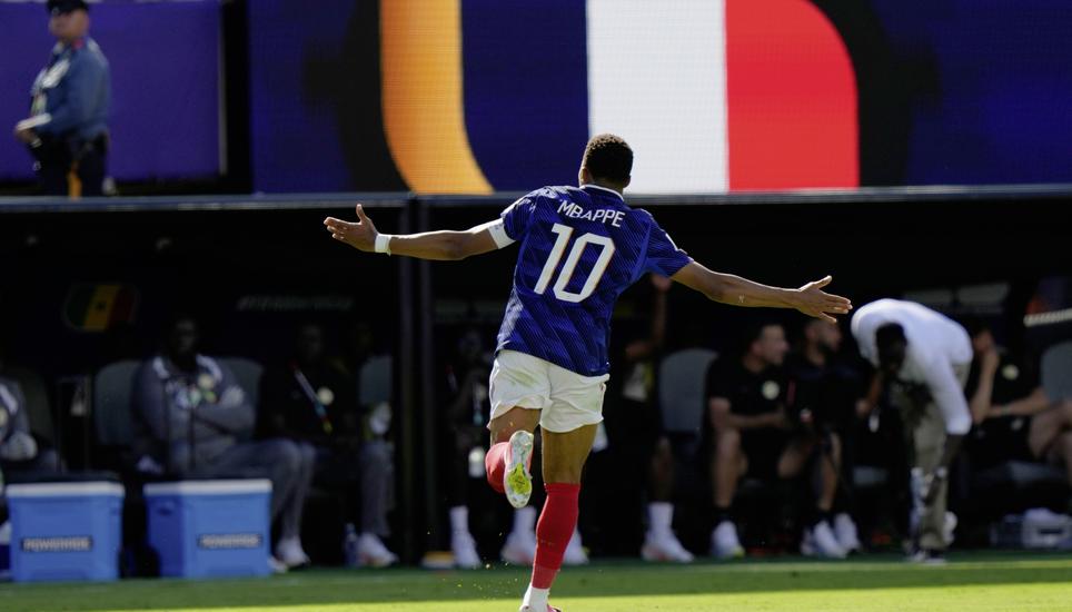 France's Kylian Mbappe (10) celebrates after scoring their third goal during the World Cup Group I soccer match between France and Senegal in East Rutherford, N.J., near New York, Tuesday, June 16, 2026. (AP Photo/Steve Luciano)