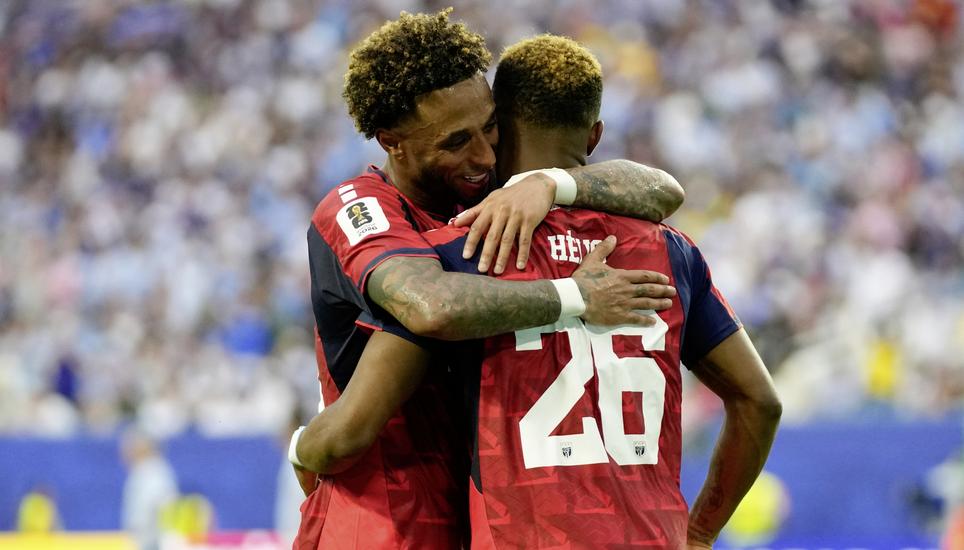 Cape Verde's Helio Varela, right, celebrates with his teammate Ryan Mendes after scoring his side's second goal against Uruguay during the World Cup Group H soccer match in Miami Gardens, Fla., Sunday, June 21, 2026. (AP Photo/Lynne Sladky)