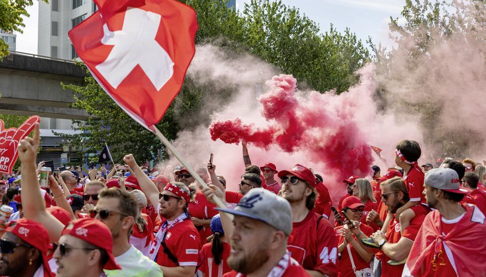 Switzerland fans march toward B.C. Place before the World Cup Group B soccer match between Switzerland and Canada in Vancouver, British Columbia, Wednesday, June 24, 2026. (Timothy Matwey/The Canadian Press via AP)