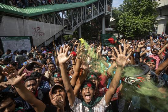 Protesters shout slogans as they celebrate Prime Minister Sheikh Hasina's resignation, in Dhaka, Bangladesh, Monday, Aug. 5, 2024. (AP Photo/Rajib Dhar)