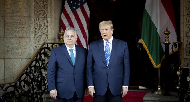 epa11208137 A handout photo made available by the Hungarian Prime Minister's Office shows  
former US President and Republican presidential candidate Donald Trump (R) and Hungarian Prime Minister Viktor Orban posing for photographers before their meeting 