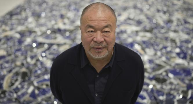 Dissident Chinese artist and activist Ai Weiwei poses for a photograph at his exhibition "Making Sense" at the Design Museum, in London, Tuesday, April 4, 2023. (AP Photo/Kin Cheung)