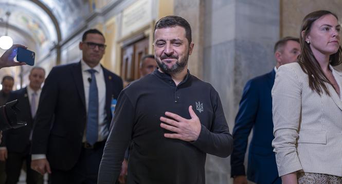 Ukrainian President Volodymyr Zelenskyy, center, gestures with his hand over his heart after a closed meeting with lawmakers in the House of Representatives about the war effort against Russia, at the Capitol in Washington, Thursday, Sept. 26, 2024. (AP P
