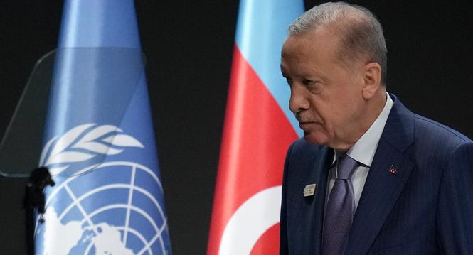 Turkey President Recep Tayyip Erdogan leaves after speaking during a plenary session at the COP29 U.N. Climate Summit, Tuesday, Nov. 12, 2024, in Baku, Azerbaijan. (AP Photo/Rafiq Maqbool)