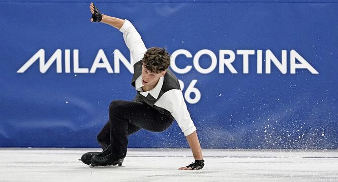 Lukas Britschgi of Switzerland falls during the men's figure skating short program at the 2026 Winter Olympics, in Milan, Italy, Tuesday, Feb. 10, 2026. (AP Photo/Ashley Landis)
