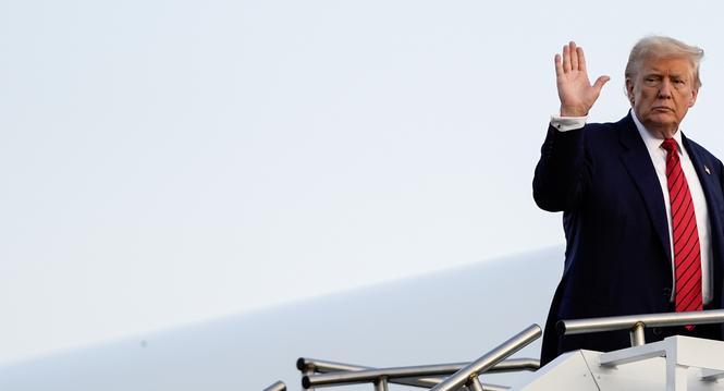 President Donald Trump waves while boarding Air Force One at Lehigh Valley International Airport, Sunday, Aug. 3, 2025, in Allentown, Pa. (AP Photo/Julia Demaree Nikhinson)
