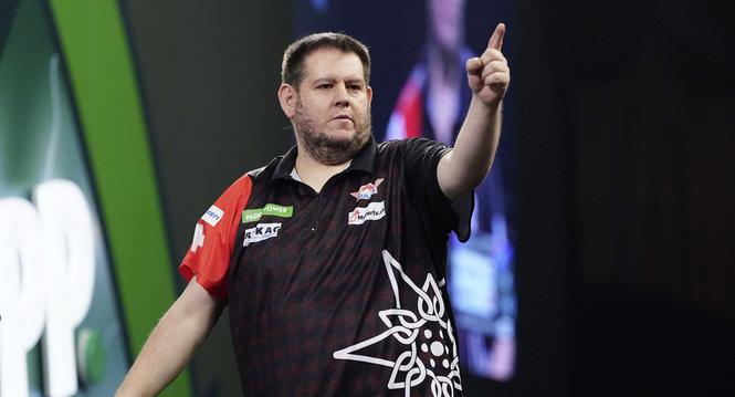 Stefan Bellmont plays his match against Raymond van Barneveld on day seven of the Paddy Power World Darts Championship at the Alexandra Palace in London, Wednesday, Dec. 17, 2025. (Bradley Collyer/PA via AP)