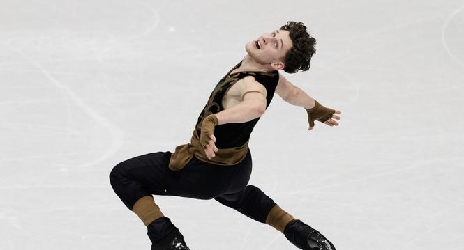Lukas Britschgi of Switzerland competes during the men's free skate program in figure skating at the 2026 Winter Olympics, in Milan, Italy, Friday, Feb. 13, 2026. (AP Photo/Francisco Seco)