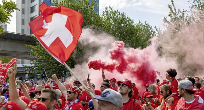 Switzerland fans march toward B.C. Place before the World Cup Group B soccer match between Switzerland and Canada in Vancouver, British Columbia, Wednesday, June 24, 2026. (Timothy Matwey/The Canadian Press via AP)